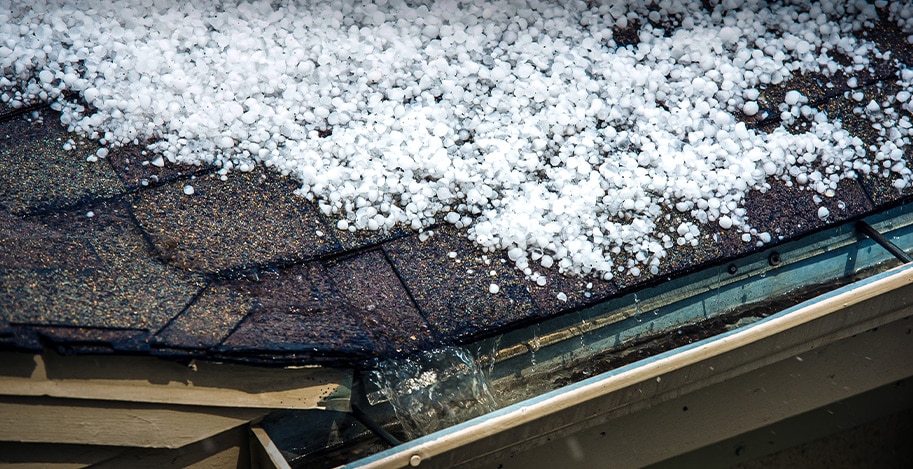 Hail on asphalt roof of residential home