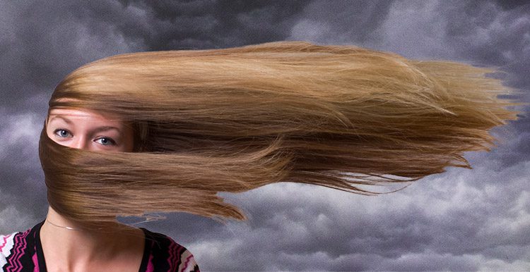 Lady in storm with wind blown hair
