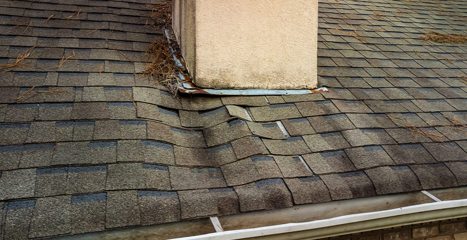 Sagging asphalt roof on residential home